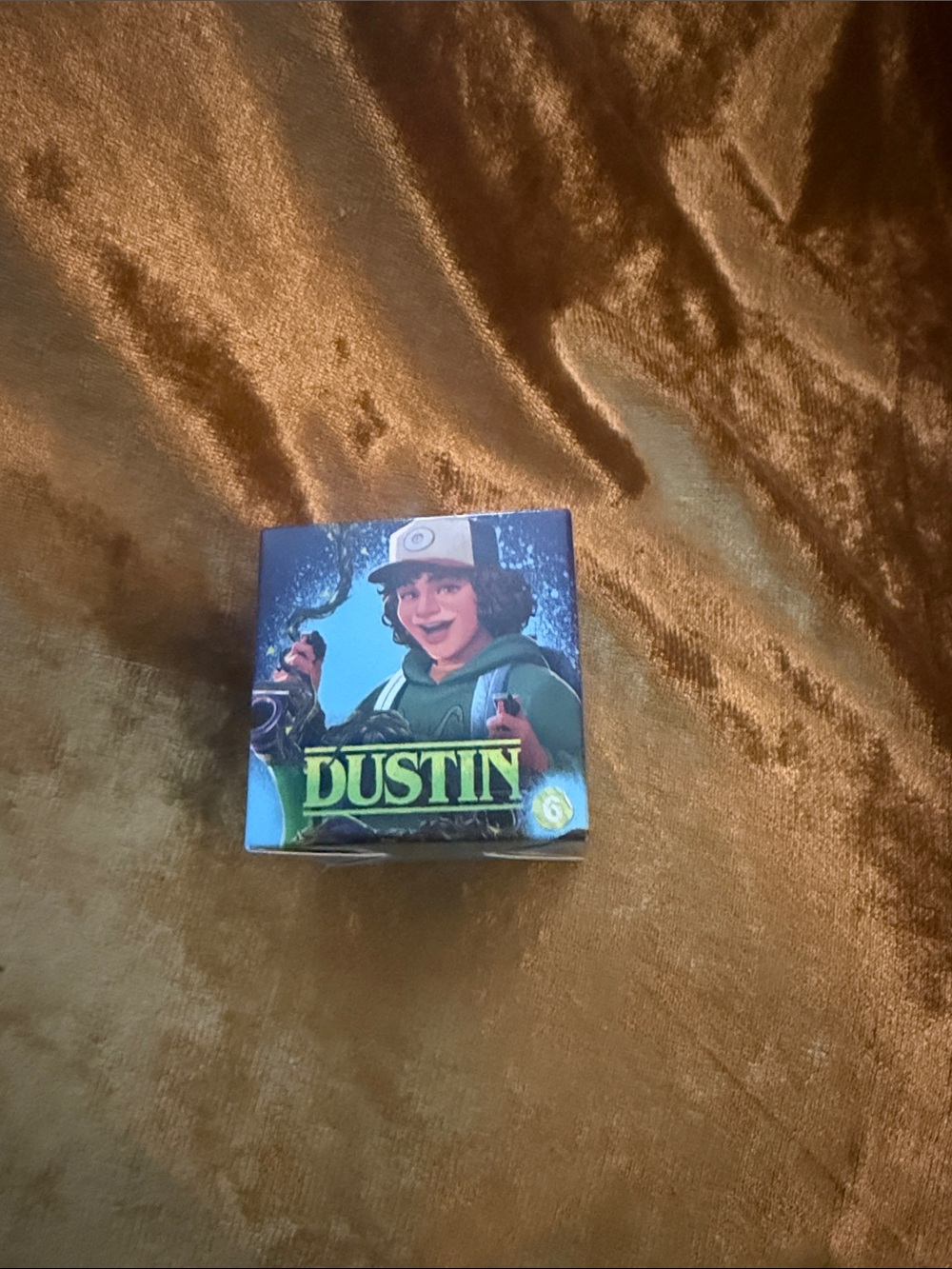 the Dustin Henderson (#6) collectible toy in its packaging from the 2026 McDonal